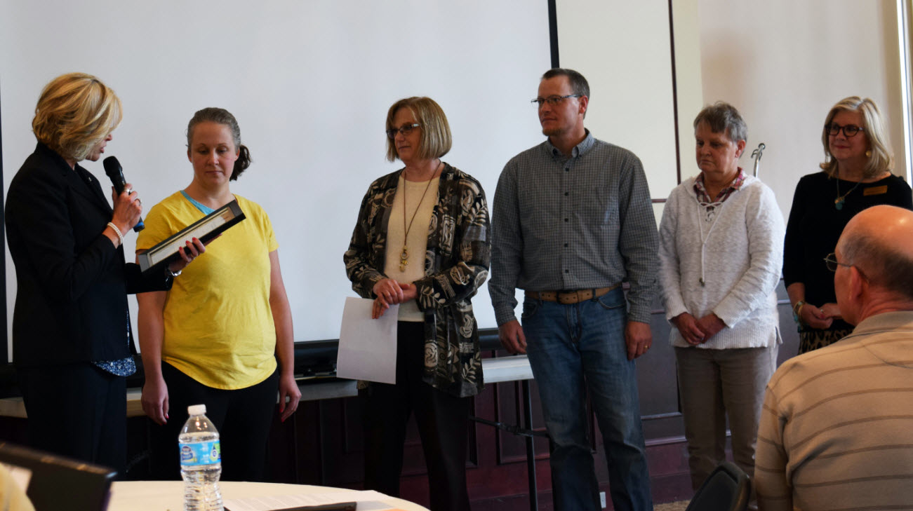 Shawnee County Commissioner Shelly Buhler, Melissa B. with Topeka Metro (accepting on behalf of Vicki P.), Cindy Patton with Topeka City of Character, Josh B. with Topeka Metro, Dee L. with Topeka Metro, and Susan Duffy, Topeka Metro general manager.
