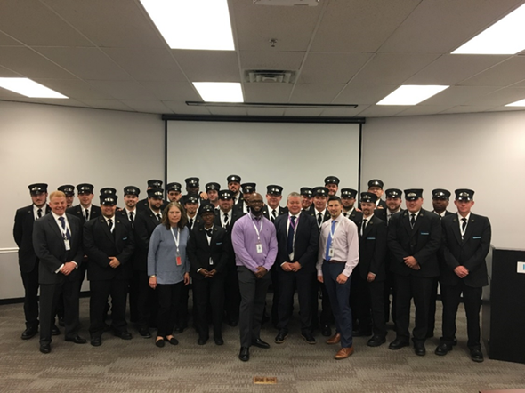 The new assistant conductor class is pictured with South Side Operations Director Bobby Huggan, Transportation Trainer Denise Langley, Transportation Trainer Gregory McNeill, Keolis CEO and General Manager David Scorey and Transportation Trainer Mike O&rsquo;Neil.