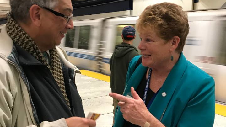 Grace Crunican greeting a BART rider during Transit Week held September 2018.