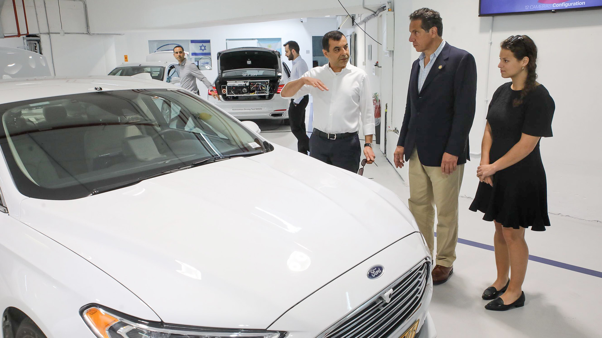 Mobileye Founder and CEO Amnon Shashua, left, provides a tour of the company's Jerusalem facility to New York Gov. Andrew Cuomo on June 28.
