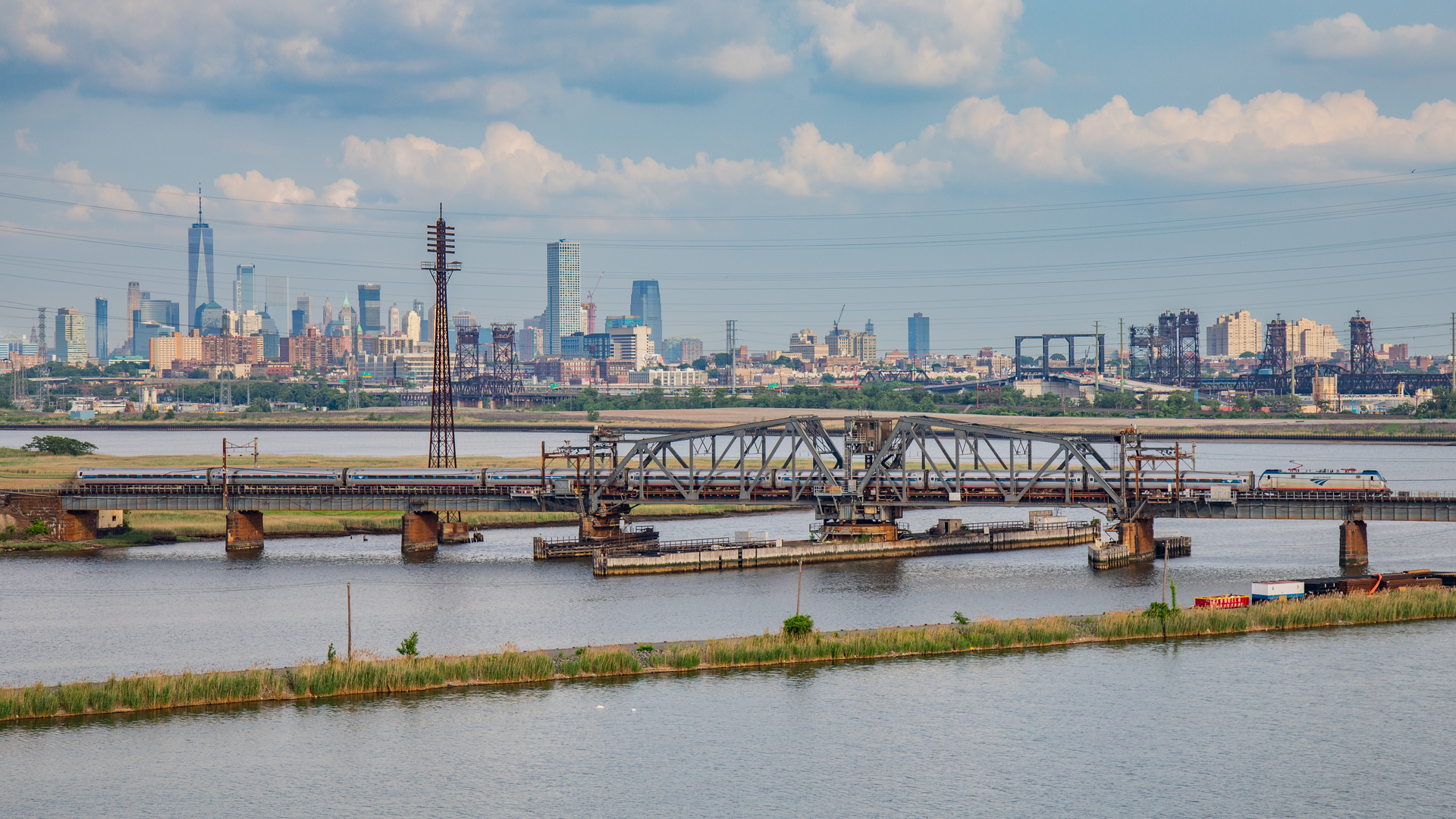 The Portal Bridge with New York City in the background.