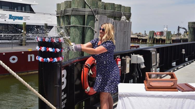 Hyde County Manager Kris Noble christened the N.C. Department of Transportation&rsquo;s new vehicle ferry, the M/V Rodanthe. The June 28 event also included a celebration of the inaugural season of the new passenger ferry, the Ocracoke Express.&NegativeMediumSpace;
