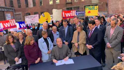 Gov. Polis signs his first executive order. Gov. Polis signs his first executive order.