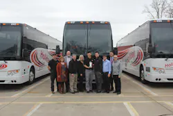 Holiday Tours team members celebrate the company's 100th Prevost coach purchase. Holiday Tours team members celebrate the company's 100th Prevost coach purchase.