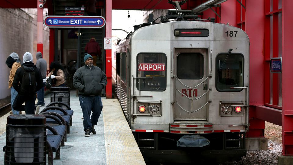 Riders wait to board RTA trains at the W. 25th-Ohio City station, Friday, February 11, 2019.