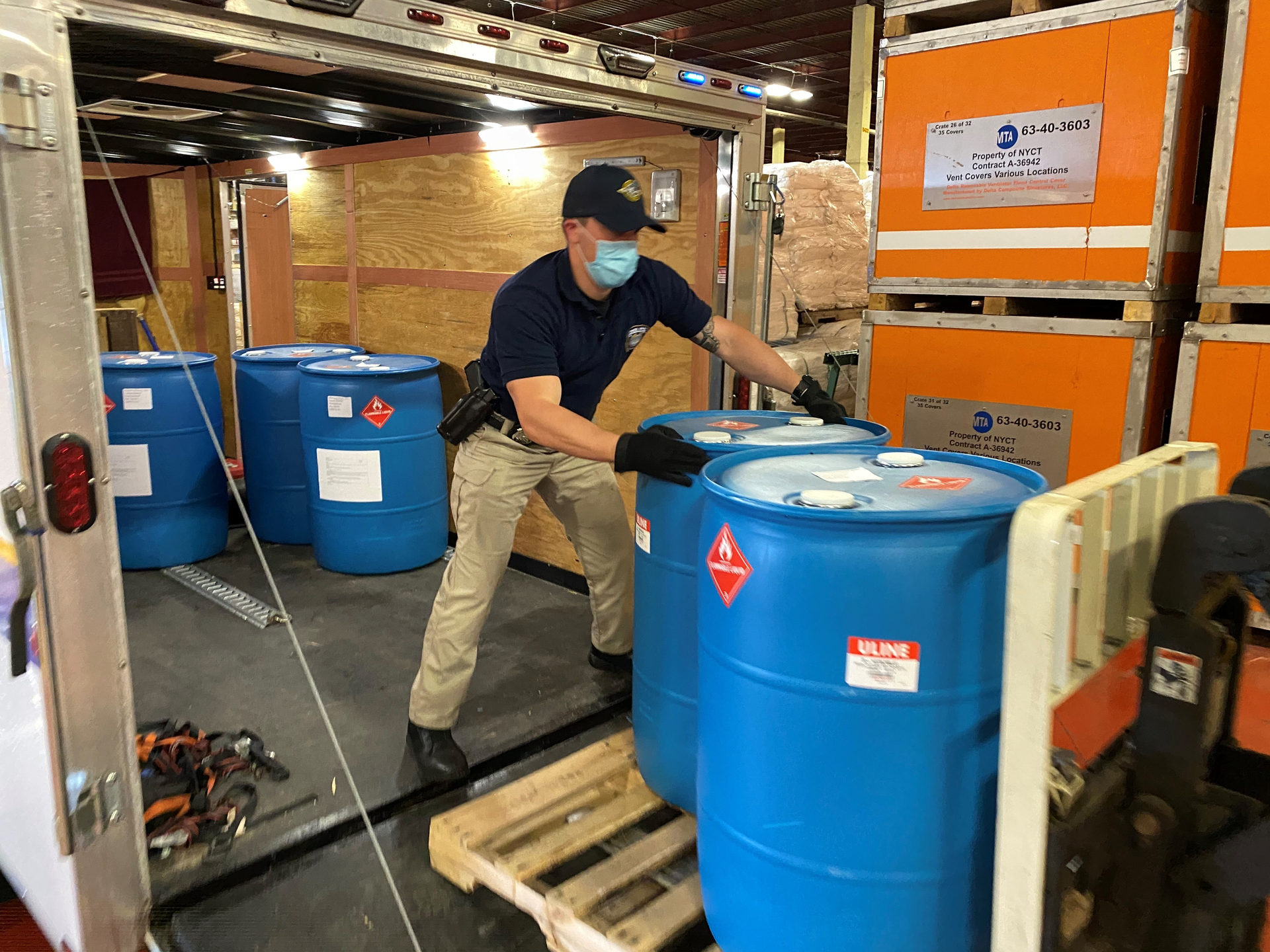 MTA Police Department's Highway Unit picks up 19 barrels of hand sanitizer.