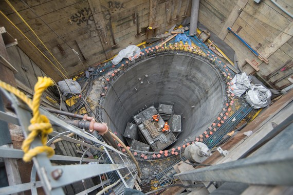 During construction, a cement casing was built down approximately 200 feet after excavation.