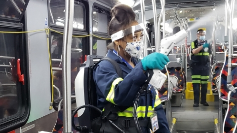 Denver RTD team members disinfect a bus using the EvaClean Protexus Backpack.