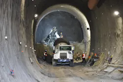 East portal: Tunnel One has surpassed the 50 per cent excavation mark. Shotcrete is applied using robotic technology fed by a cement truck. East portal: Tunnel One has surpassed the 50 per cent excavation mark. Shotcrete is applied using robotic technology fed by a cement truck.
