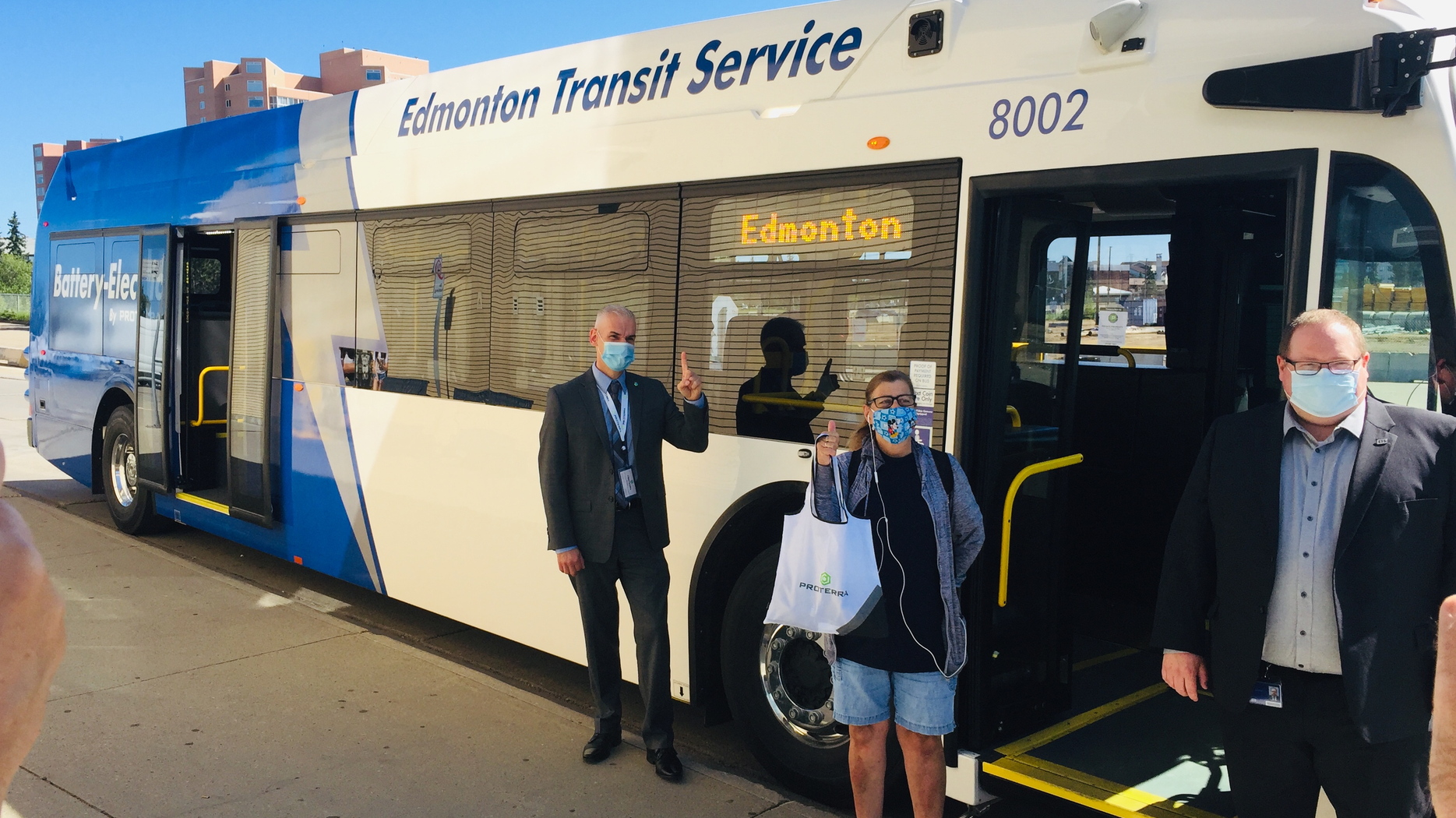 Tammy, center, was the first ETS customer to ride the battery-electric bus, which entered service Aug. 4.