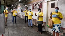 MTA's 'Mask Force' distributing disposable masks to riders in July. MTA's 'Mask Force' distributing disposable masks to riders in July.