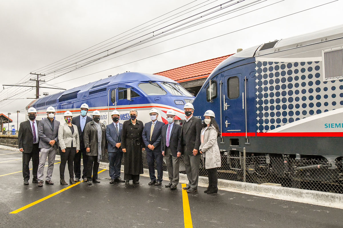 Officials celebrate the beginning of station improvements at the Homewood Amtrak and Metra station.