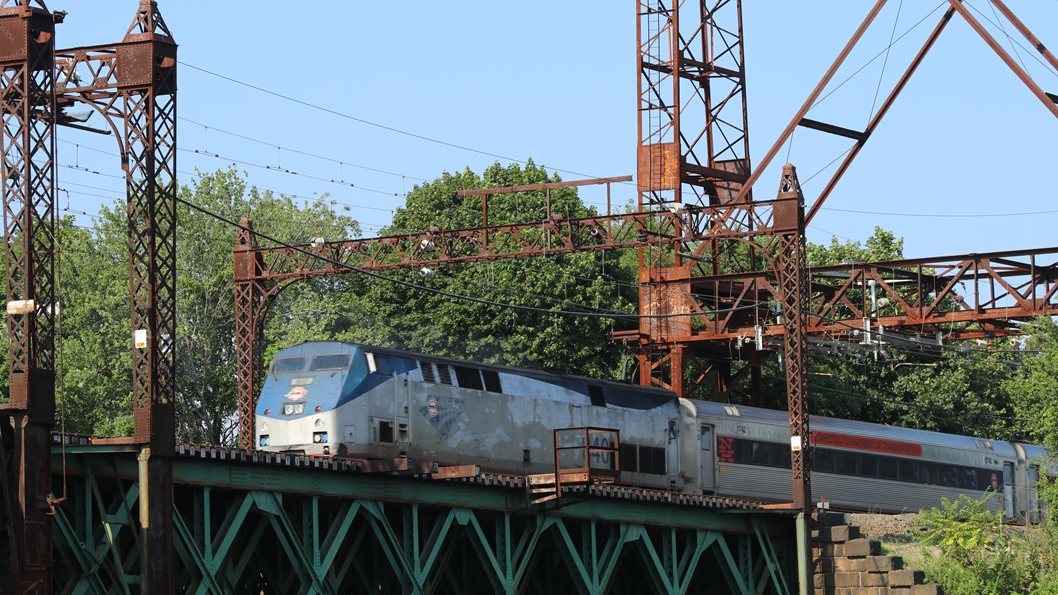 A Metro-North train moving across the Walk Bridge.