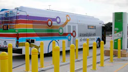 A New Flyer bus is charged using a Proterra charger. A New Flyer bus is charged using a Proterra charger.