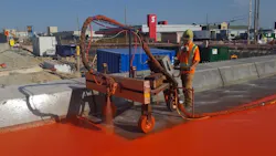 Construction crews waterproofing the bridge deck. Construction crews waterproofing the bridge deck.