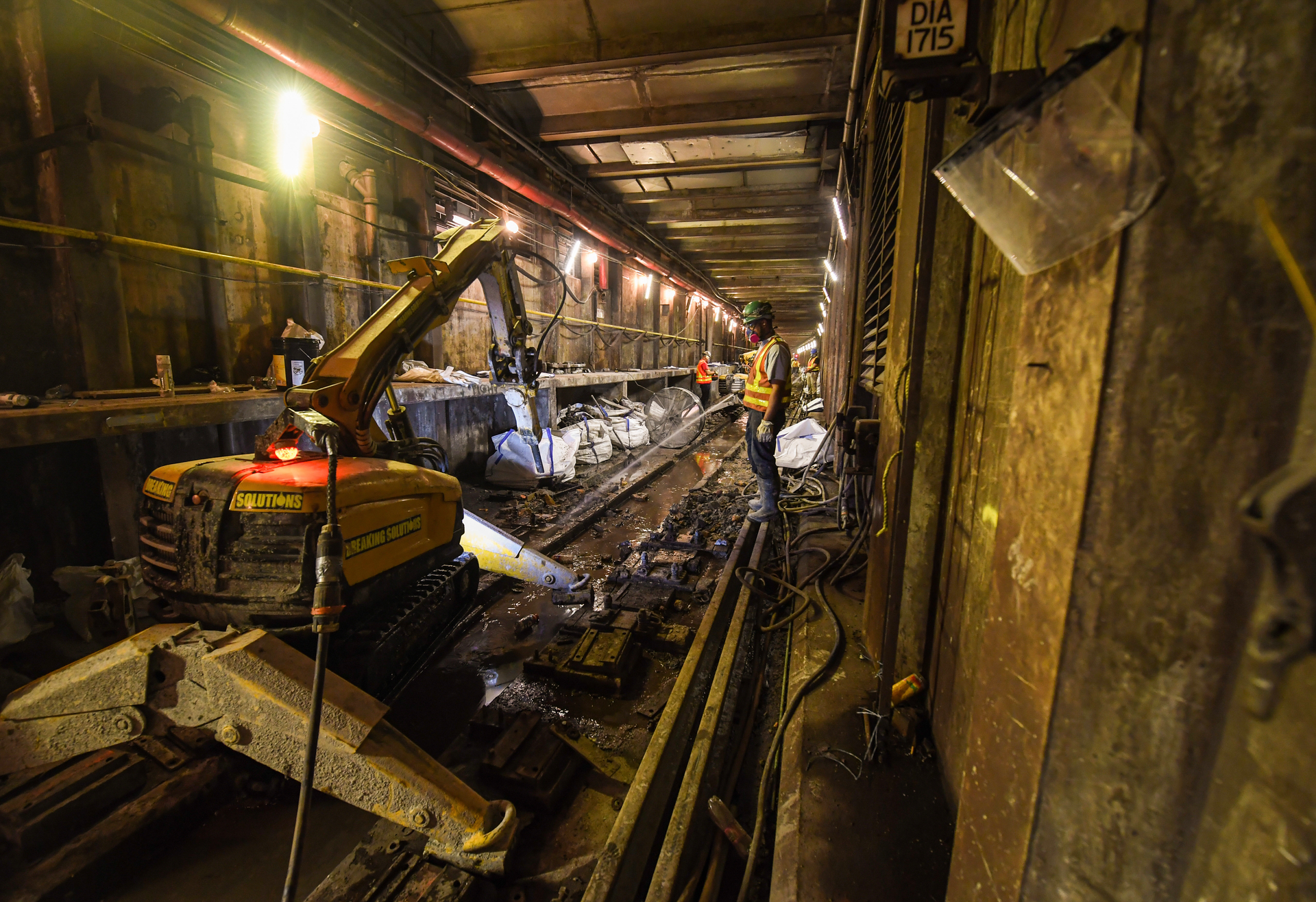 Contractors performing work on the Archer Avenue E line at Sutphin Blvd-Archer Av-JFK Airport station.