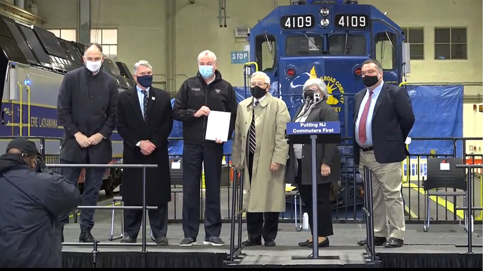 Left to right, Amtrak President Stephen Gardner, NJ Transit President and CEO Kevin Corbett, New Jersey Gov. Phil Murphy, FRA Administrator Ronald Batory, New Jersey Department of Transportation Commissioner and NJ Transit Chair Diane Gutierrez-Scaccetti and Parsons Principal Project Manager Terry Fetters, at a ceremony Dec. 18 to mark the certification of NJ Transit's PTC system.