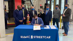 City Manager for Kansas City, Mo., Brian David Platt, seated, signs the FFGA finalizing the $174-million in funds through the CIG Program for the KC Streetcar Main Street extension. City Manager for Kansas City, Mo., Brian David Platt, seated, signs the FFGA finalizing the $174-million in funds through the CIG Program for the KC Streetcar Main Street extension.