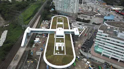 Aerial view of the Kipling Transit Hub footprint with green roof installed on the bus terminal and pedestrian bridge crossing over the tracks to the GO train platform. Aerial view of the Kipling Transit Hub footprint with green roof installed on the bus terminal and pedestrian bridge crossing over the tracks to the GO train platform.