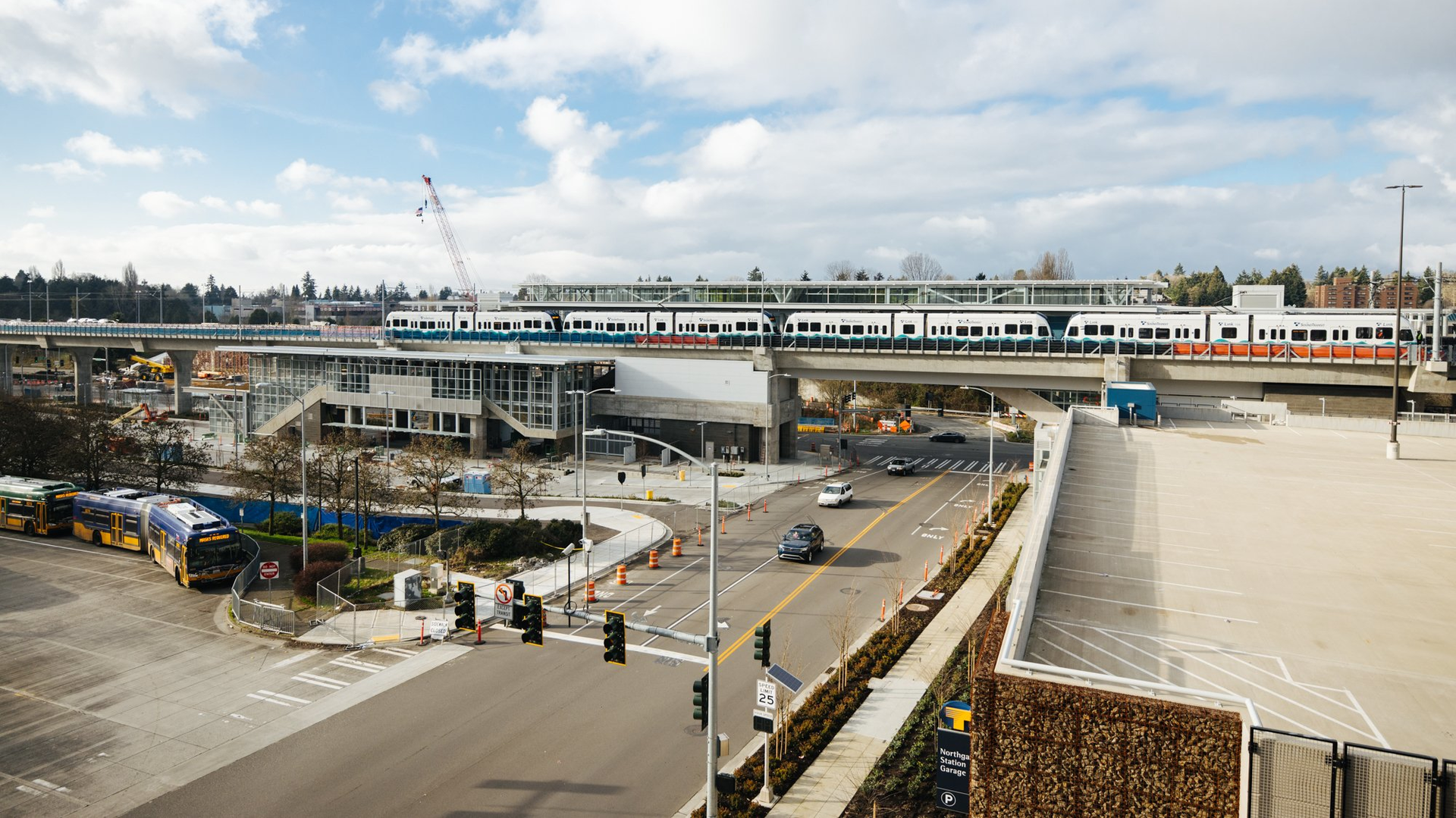 A light- rail test train sits on the tracks at the Northgate Station platform.