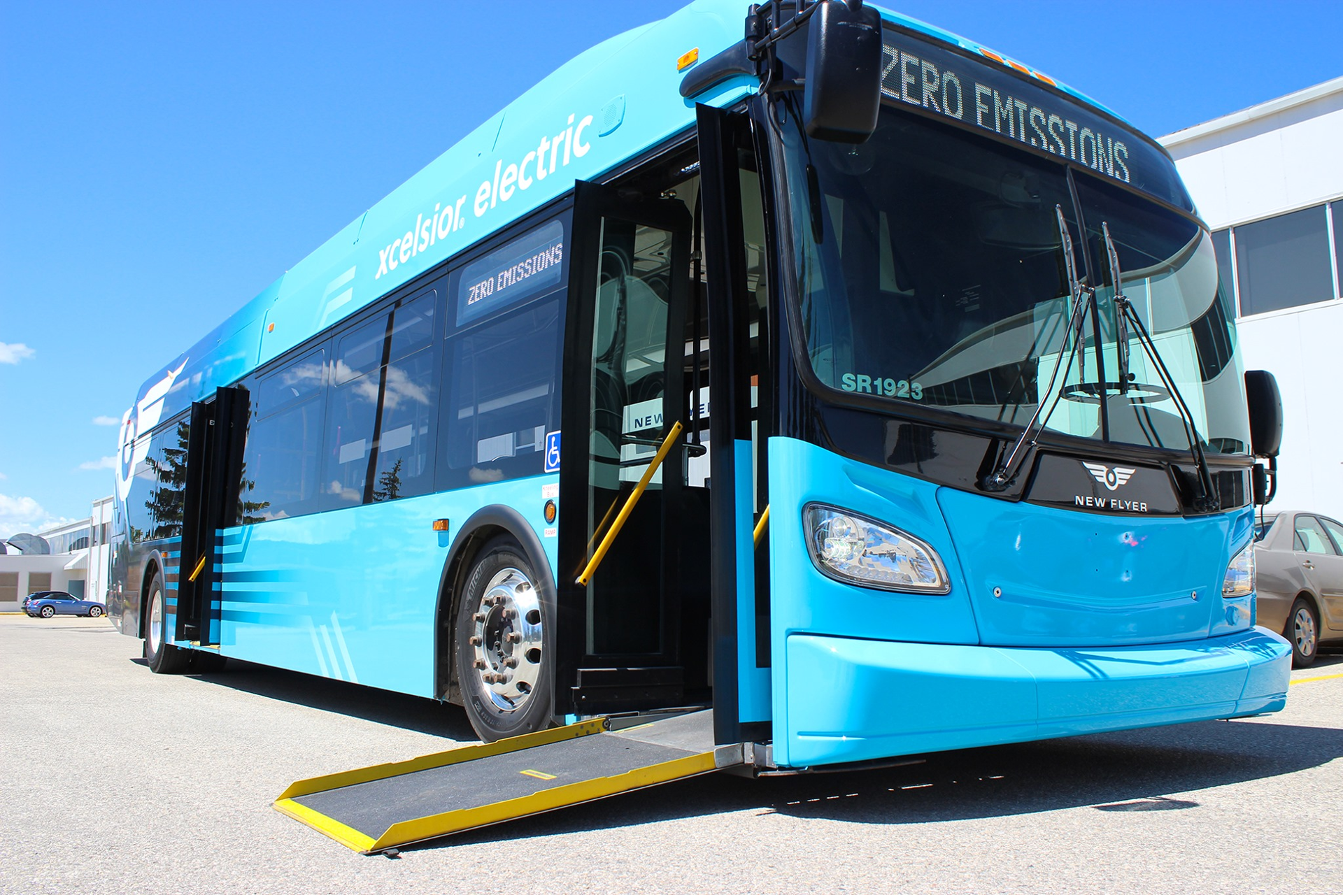 A New Flyer Xcelsior CHARGE bus with ramp deployed.
