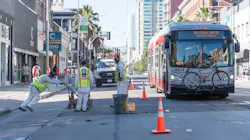 Paint shop crew removing old pavement markings for installation of temporary emergency transit only lanes. Paint shop crew removing old pavement markings for installation of temporary emergency transit only lanes.