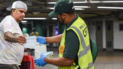 A member of New York MTA's 'Mask Force' hands out free masks to riders during a May 2021 event. A member of New York MTA's 'Mask Force' hands out free masks to riders during a May 2021 event.