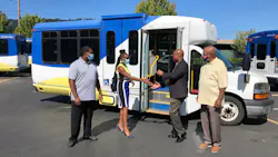 TriMet General Manager Sam Desue, Jr. hands keys to Pat Daniels, executive director of Constructing Hope. TriMet General Manager Sam Desue, Jr. hands keys to Pat Daniels, executive director of Constructing Hope.