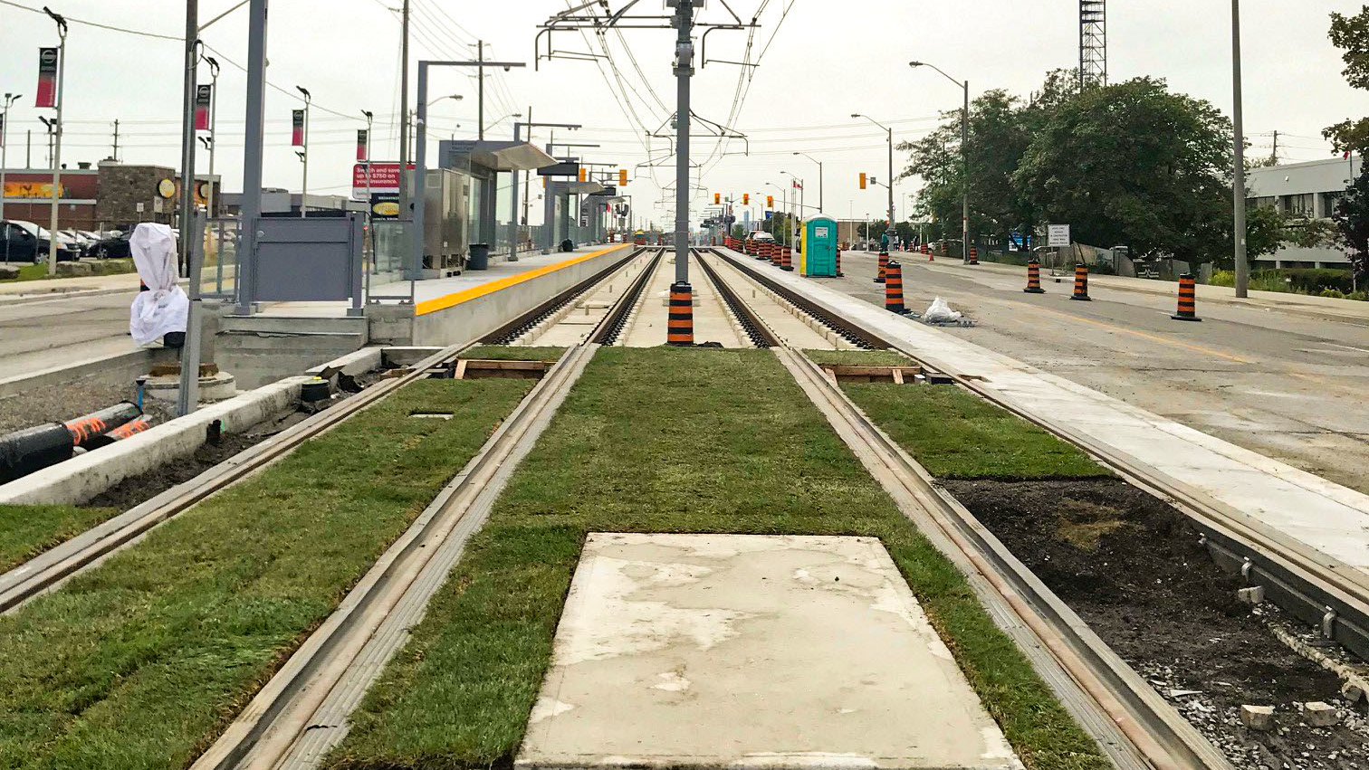 The partially installed green track mock-up at Warden Avenue&rsquo;s Golden Mile stop looking west.
