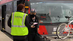 A member of the CapMetro team handing out safety care packages to riders. A member of the CapMetro team handing out safety care packages to riders.