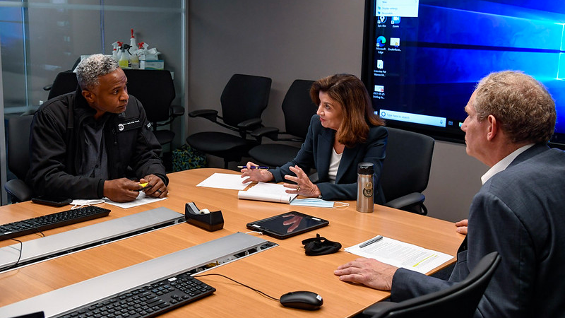 New York Gov. Kathy Hochul, center, speaks with MTA Senior Vice President of Subways Demetrius Crichlow, left, and Acting MTA Chair & CEO Janno Lieber, right, on Aug. 30 to discuss the Aug. 29 breakdown of power that affected subway service.