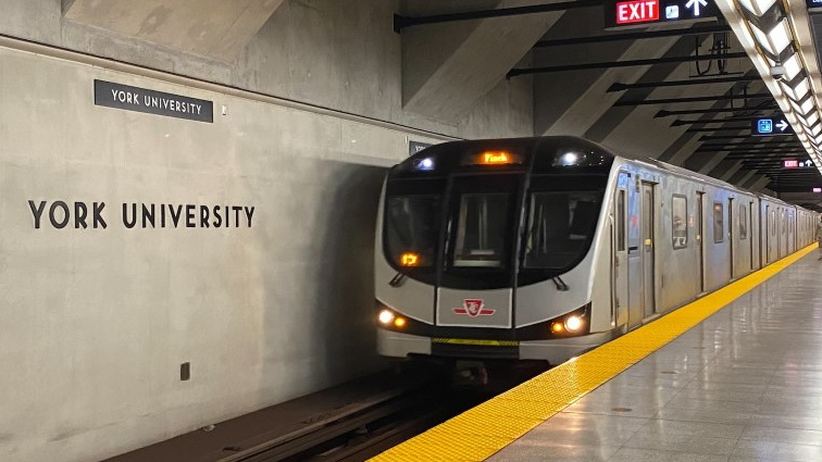A subway train arrives at York University.