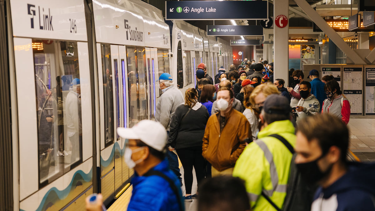 Riders take one of the first Line 1 trains during opening day, Oct. 2.