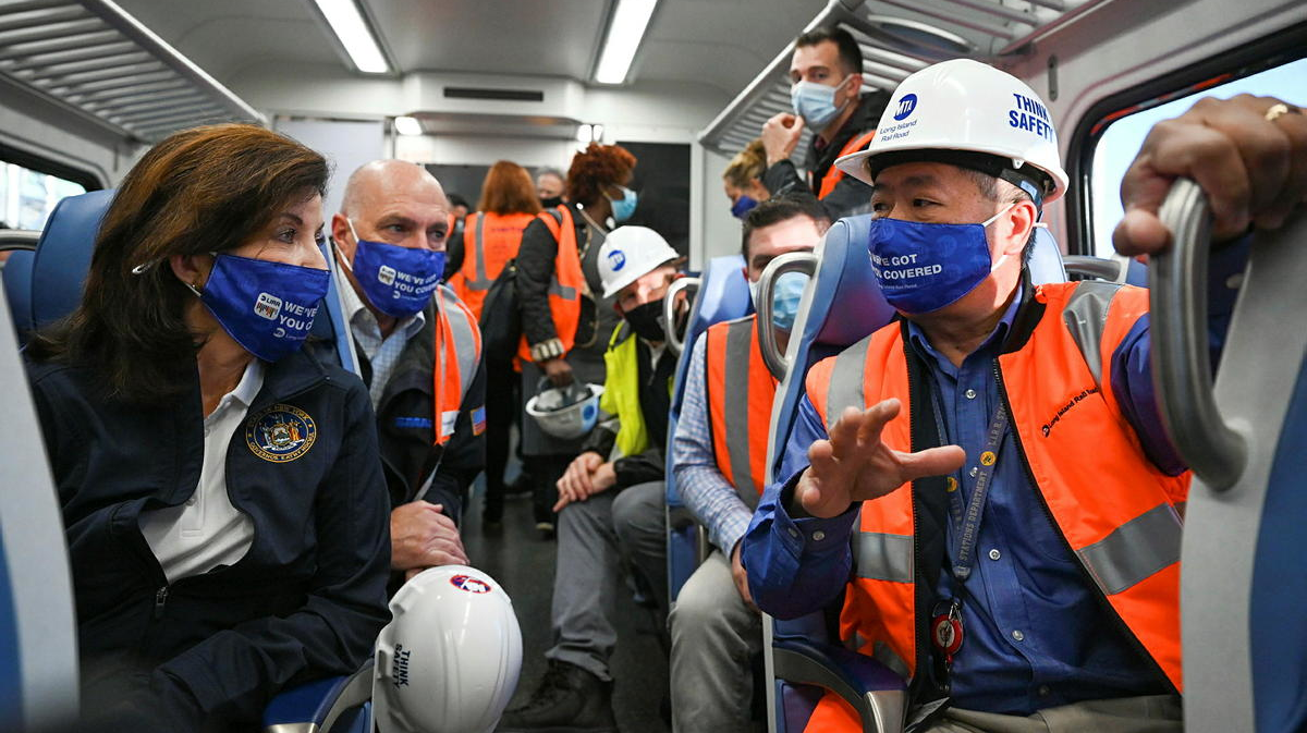 Gov. Hochul listens to LIRR President Phillip Eng on a LIRR train from Jamaica to Grand Central Terminal in Manhattan to take the first ceremonial train through the new site.