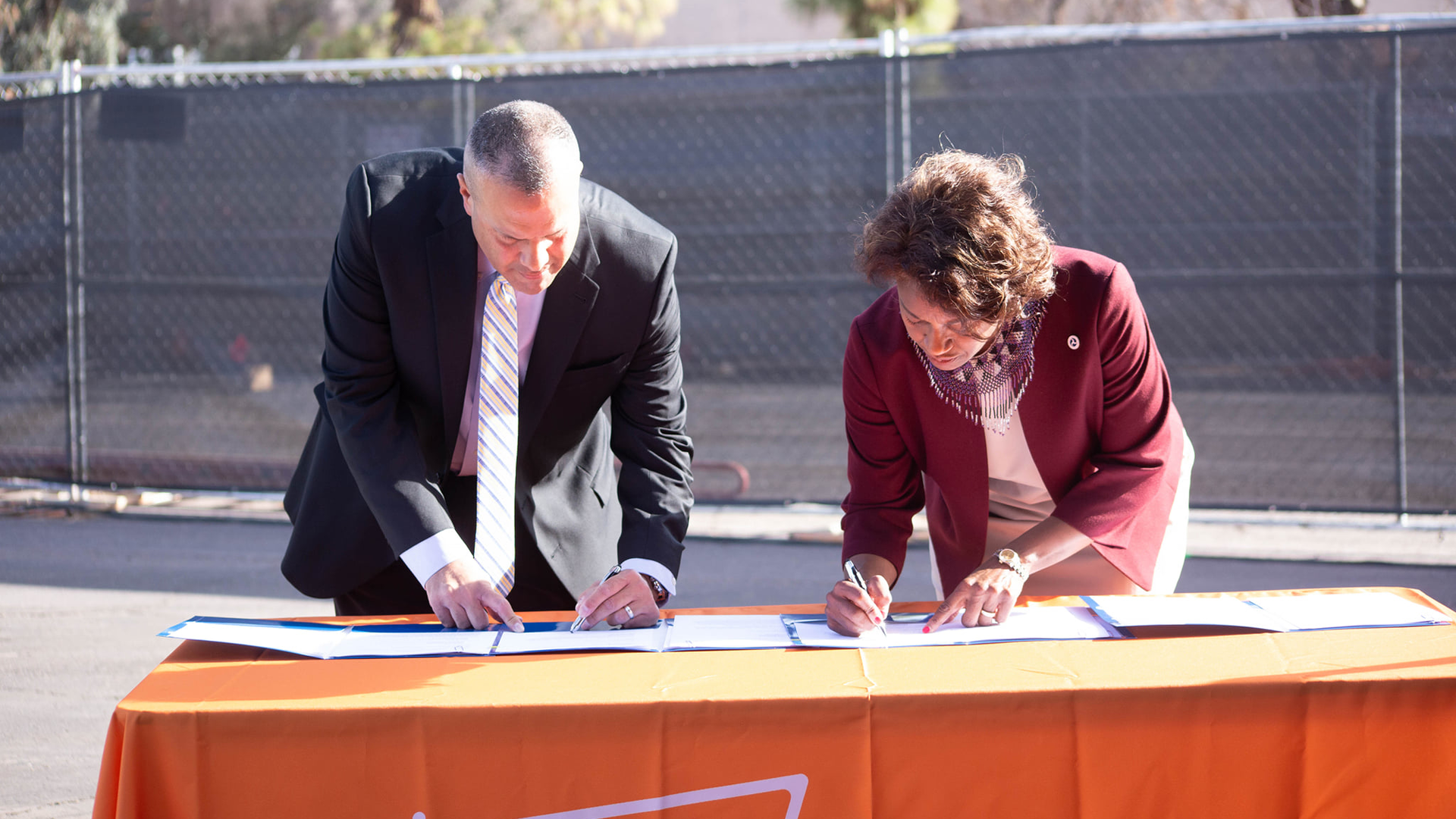 FTA Administrator Nuria Fernandez (right) signs grant agreement with Phoenix Public Transit Director Jesus Sapien.