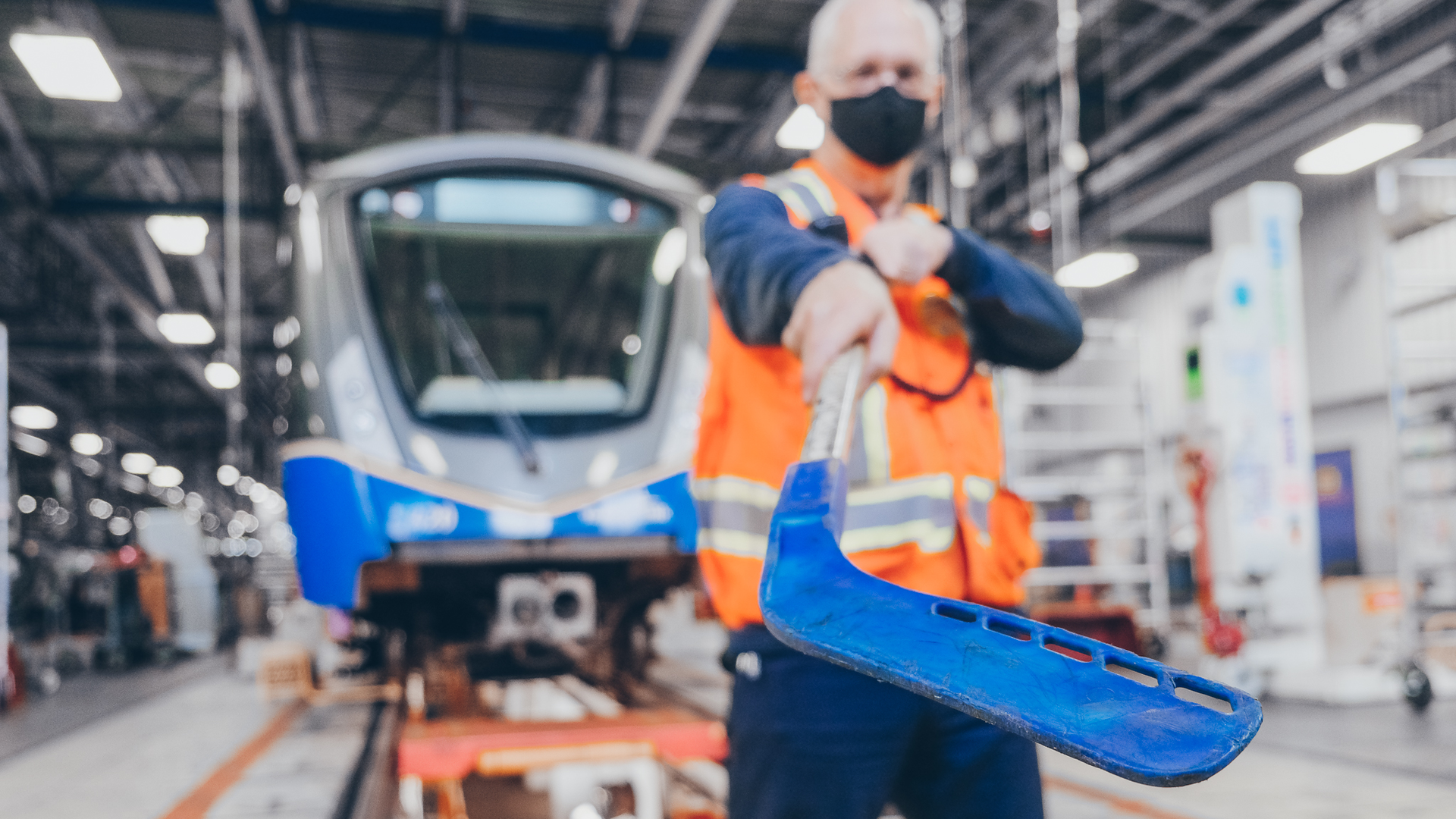 Art Wittich, a SkyTrain vehicle technologist, shows the hockey stick used to clear ice from doors during the winter season.