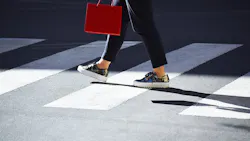 Pedestrian in crosswalk. Pedestrian in crosswalk.