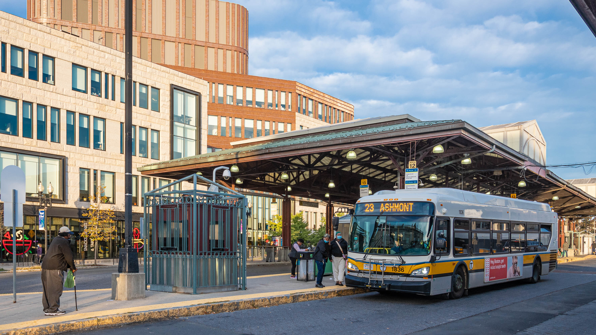 A Route 23 bus puling into a stop; the route is one of three that will operate without charging fares starting March 1 as part of a two-year program in Boston, Mass.