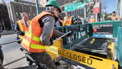 An MTA worker demonstrates how retractable stairwell covers are deployed in this October 2017 image. The covers are one of several flood mitigation devices MTA purchased and installed following Superstorm Sandy in 2012. An MTA worker demonstrates how retractable stairwell covers are deployed in this October 2017 image. The covers are one of several flood mitigation devices MTA purchased and installed following Superstorm Sandy in 2012.