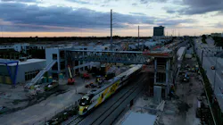 Crews worked early during the morning hours of Oct. 8 to place place a 131-foot long, 68-ton pedestrian skybridge on two 41-foot-high vertical transportation towers at Aventura Station. Crews worked early during the morning hours of Oct. 8 to place place a 131-foot long, 68-ton pedestrian skybridge on two 41-foot-high vertical transportation towers at Aventura Station.