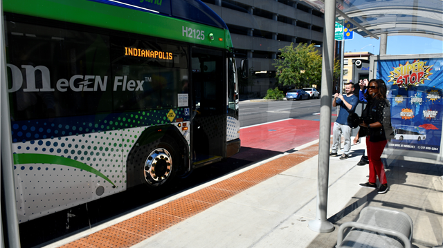 An eGen Flex Hybrid Bus Parked at the Super Stop on Delaware and New York streets.