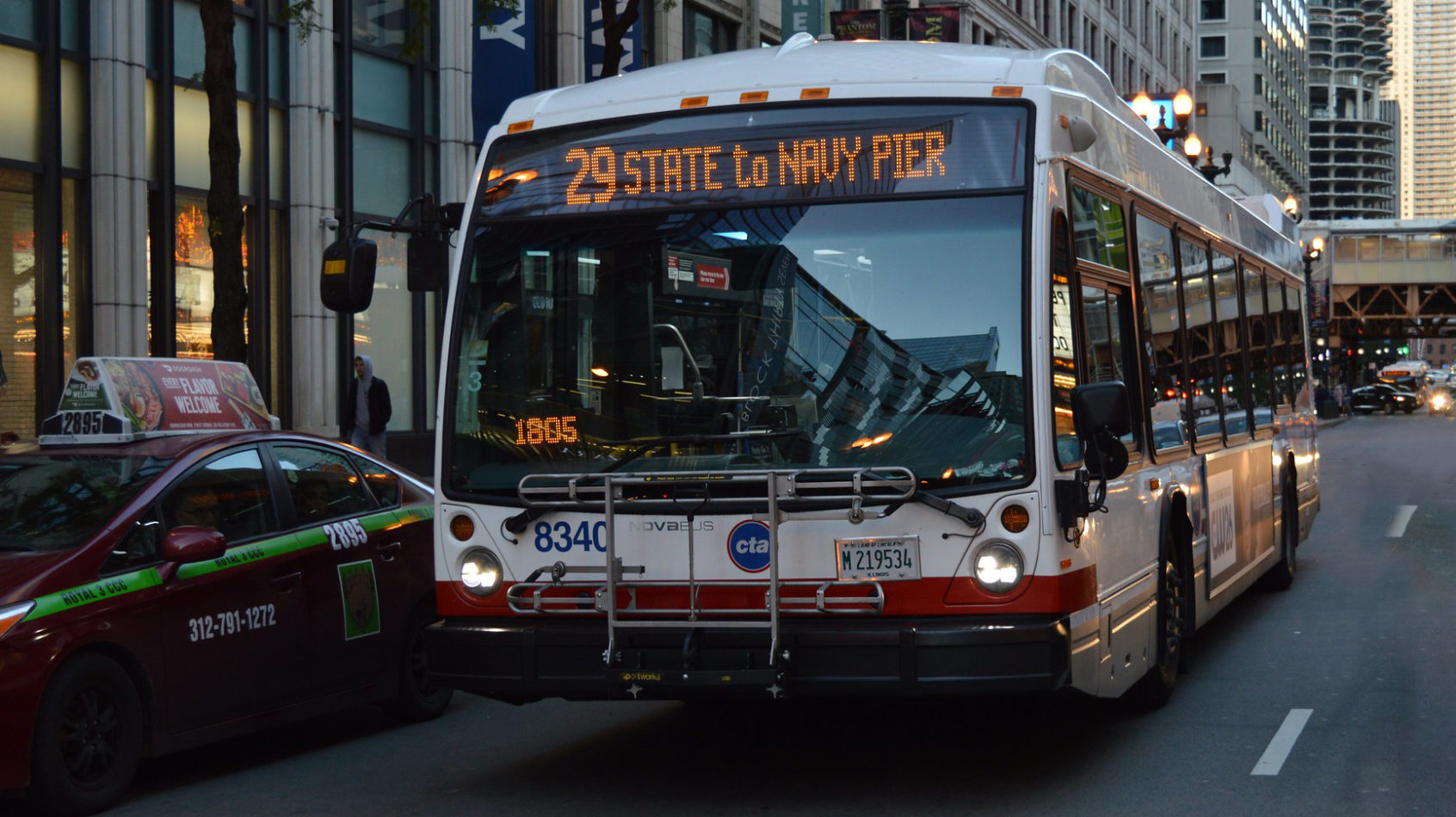 A Nova Bus vehicle operating along Chicago Transit Authority's Route 29 on State Street.