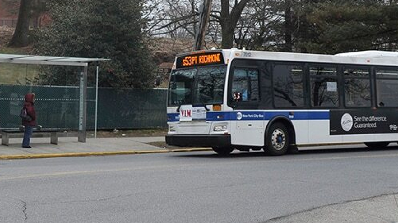 MTA bus parked next to a stop