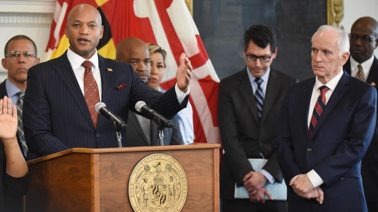 Gov. Moore speaks at an event where he announced Paul Wiedefeld, right, is his nominee to serve as Maryland's secretary of transportation.