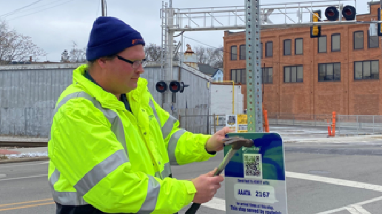 New route signs are being installed at bus stops with 'Text My Bus' information.