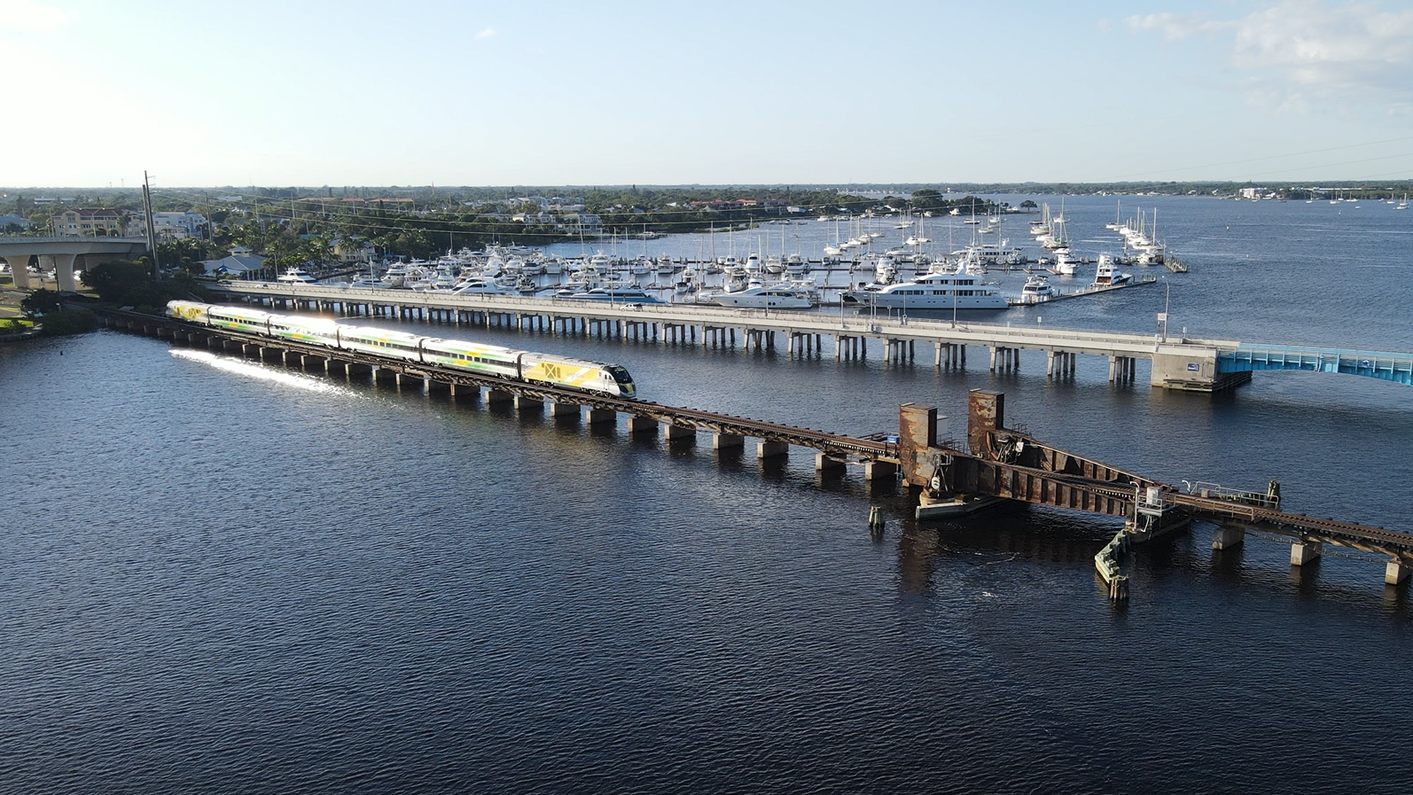 A Brightline train traverses the existing St. Lucie River Rail Bridge. Brightline has obtained clearance from the U.S. Coast Guard to temporarily close the waterway in order to perform rehabilitation work on the bridge.