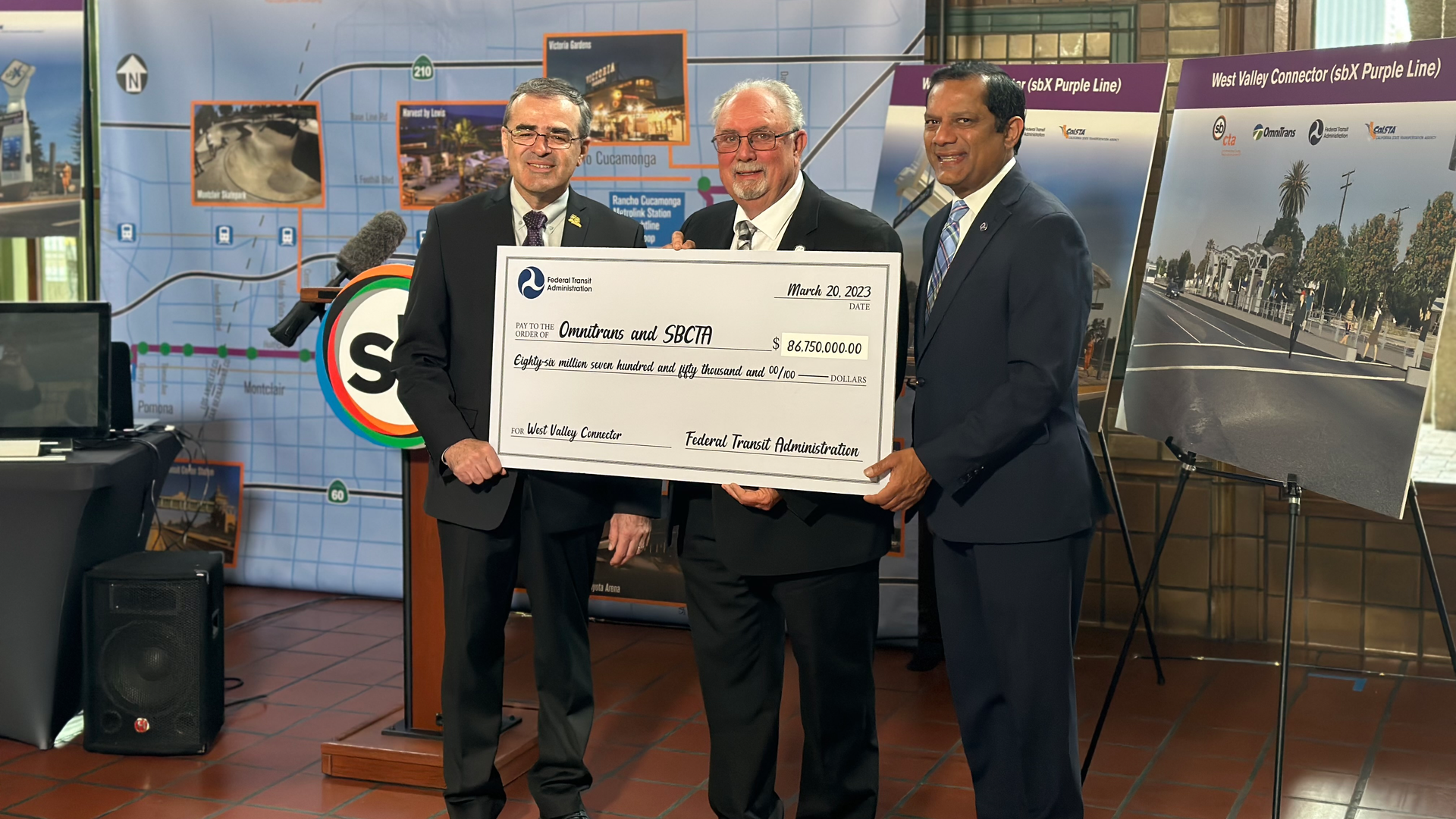 Left, Omnitrans Board Chair John Dutrey, SBCTA Board President Art Bishop and FTA Region 9 Administrator Ray Tellis ushered in a new era of sustainable transit in San Bernardino County on Monday with the presentation of an $86.75 million check for the West Valley Connector.