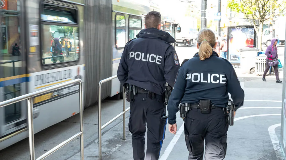 Two Metro Vancouver Transit Police officers on patrol.