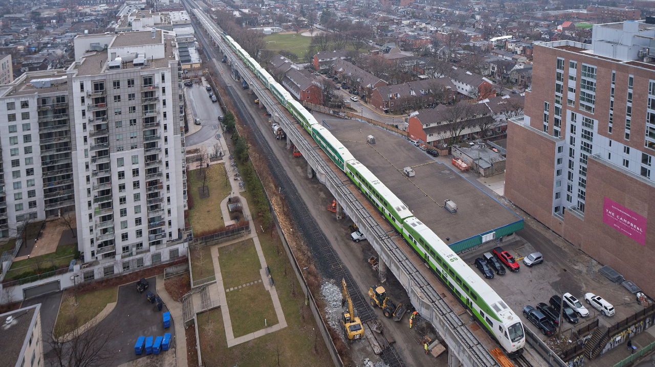 An aerial look at one of the first GO Trains to travel over the new Davenport Diamond Guideway in Toronto.