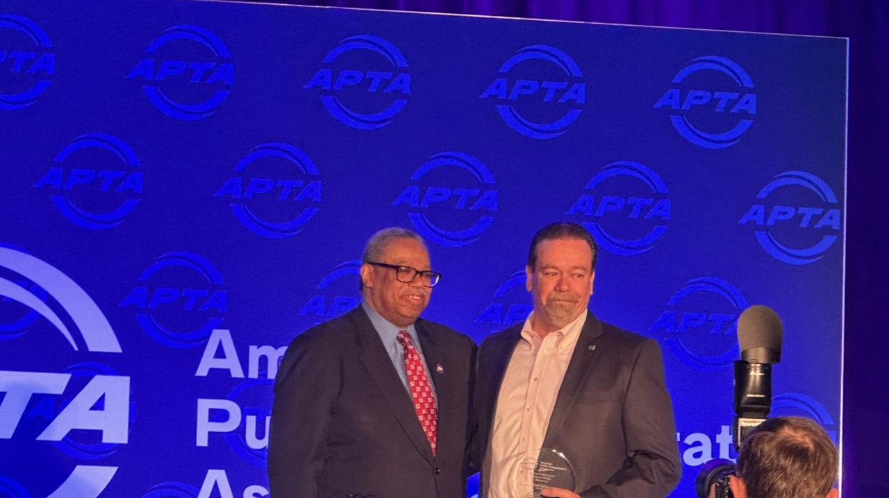 Dorval Carter, president, CTA. and New Transit accepting the Gold Award: Security for Bus System, with more than 20 million passenger trips annually.